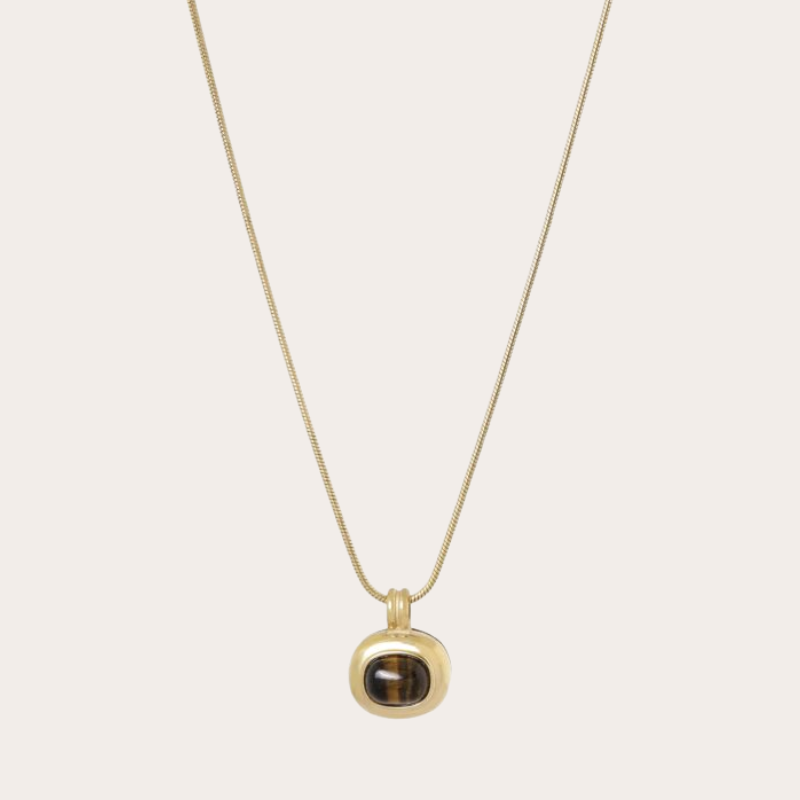 Lange ketting met gouden hanger met gemstone
